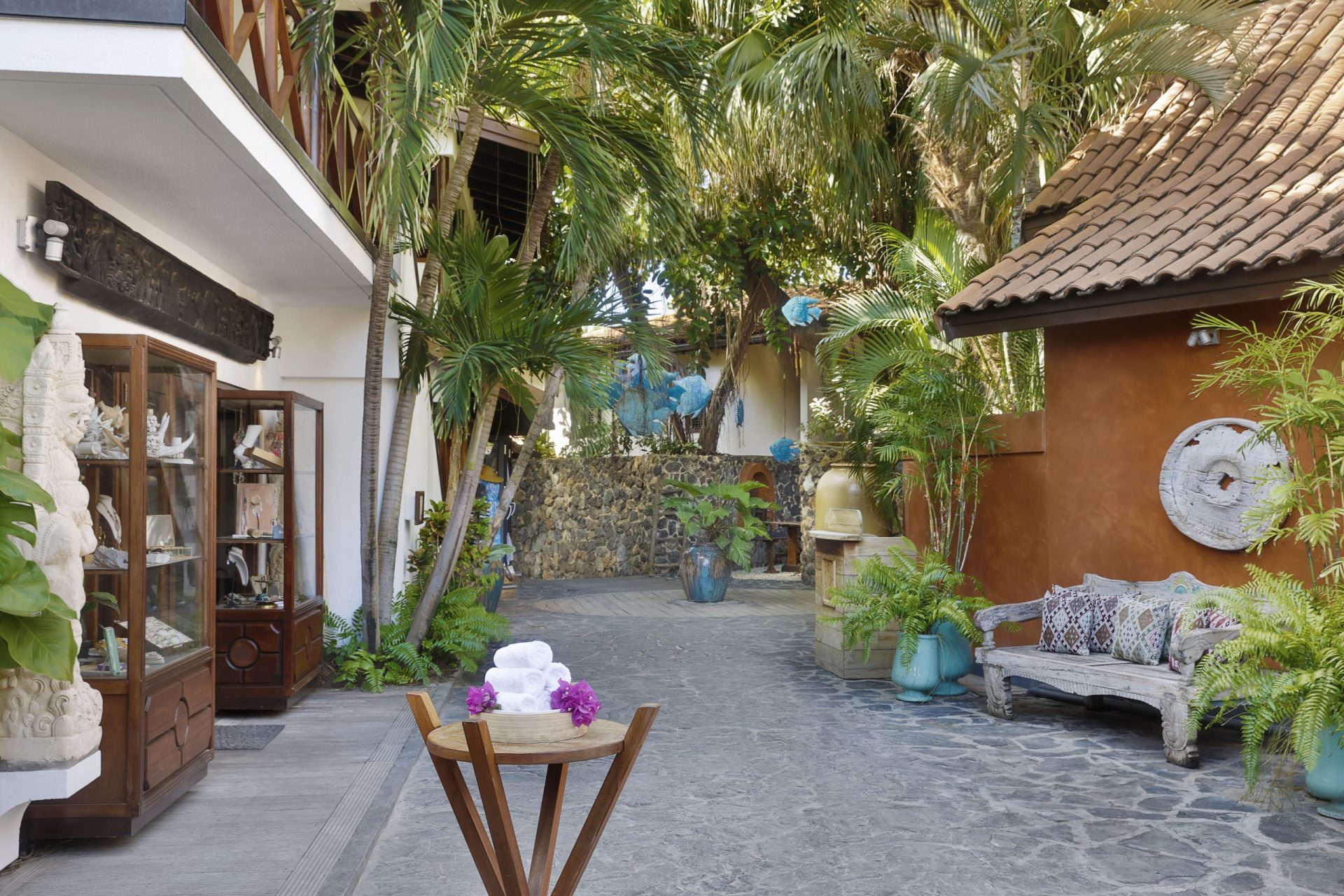 Entrance of Baoase with palm trees and buildings
