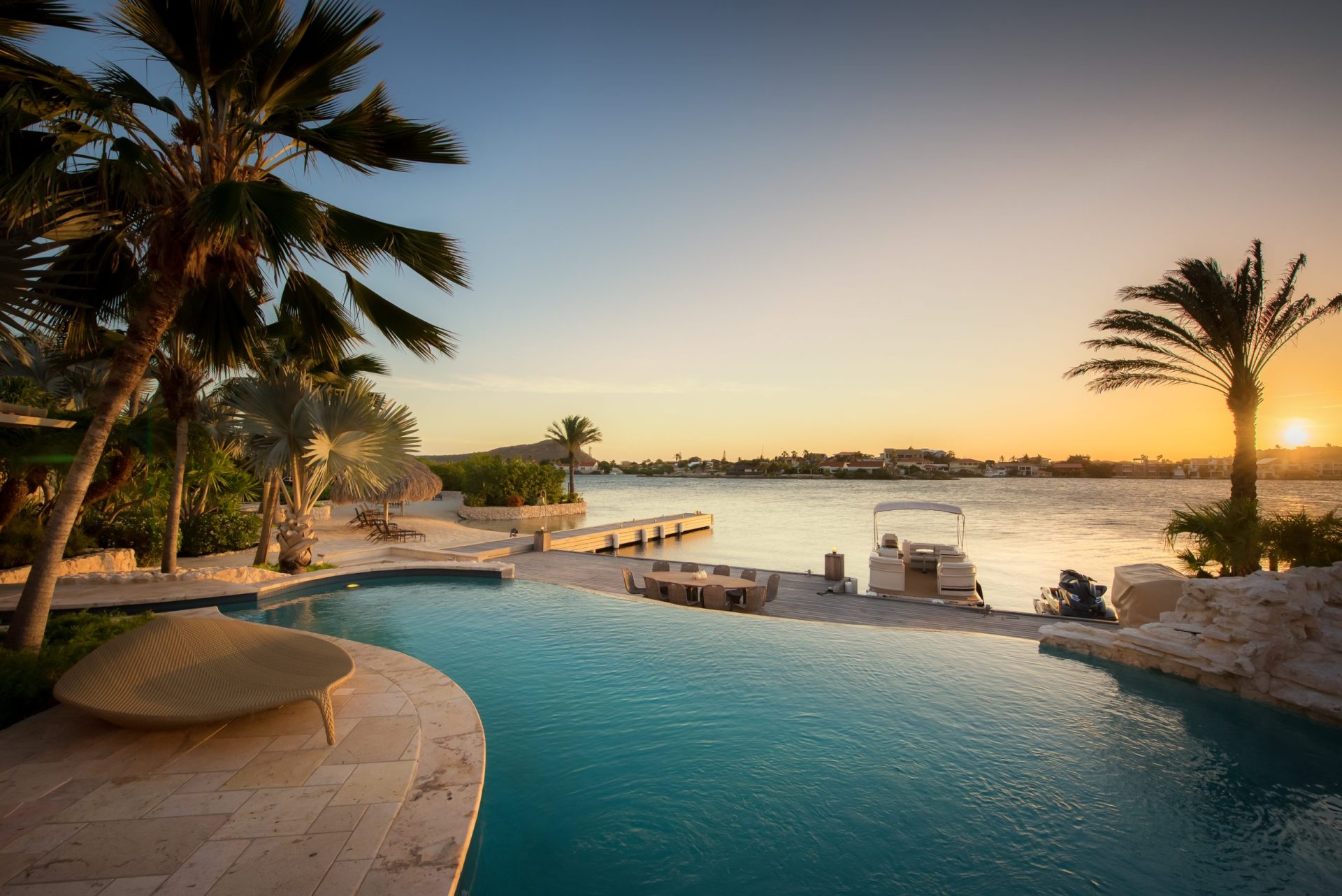 Sunset as seen from the pool at Island Kiniw